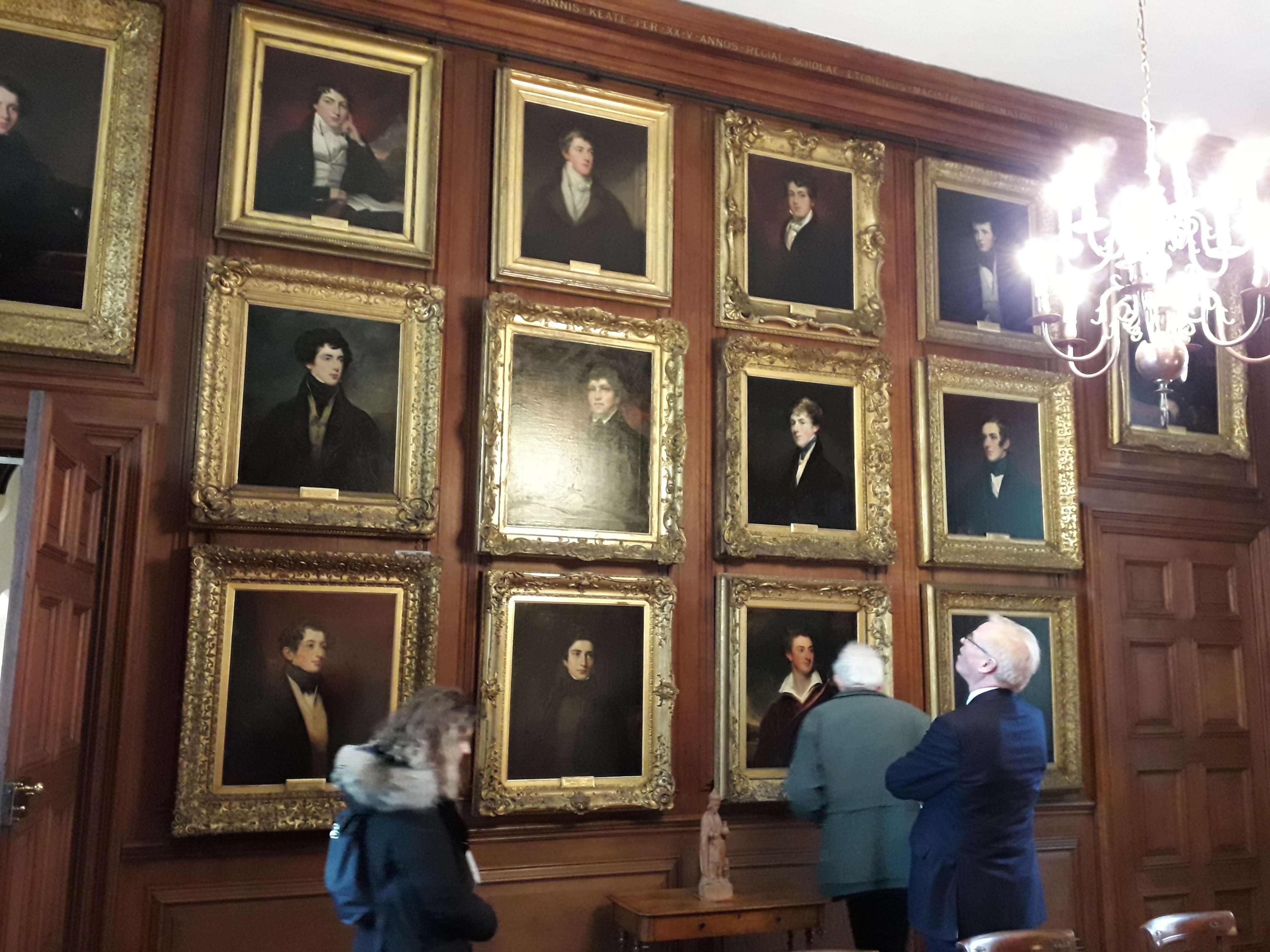 Delegates examining some of the Eton Leavers' Portraits