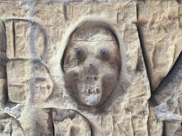Memento mori skull 'graffiti' in the cloister, Eton College. Photography by the author